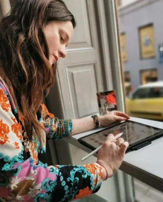 Artist Emma Forsberg working on a new painting in her studio